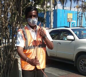 ORRCA Traffic Warden removing the loose hanging wires and cables